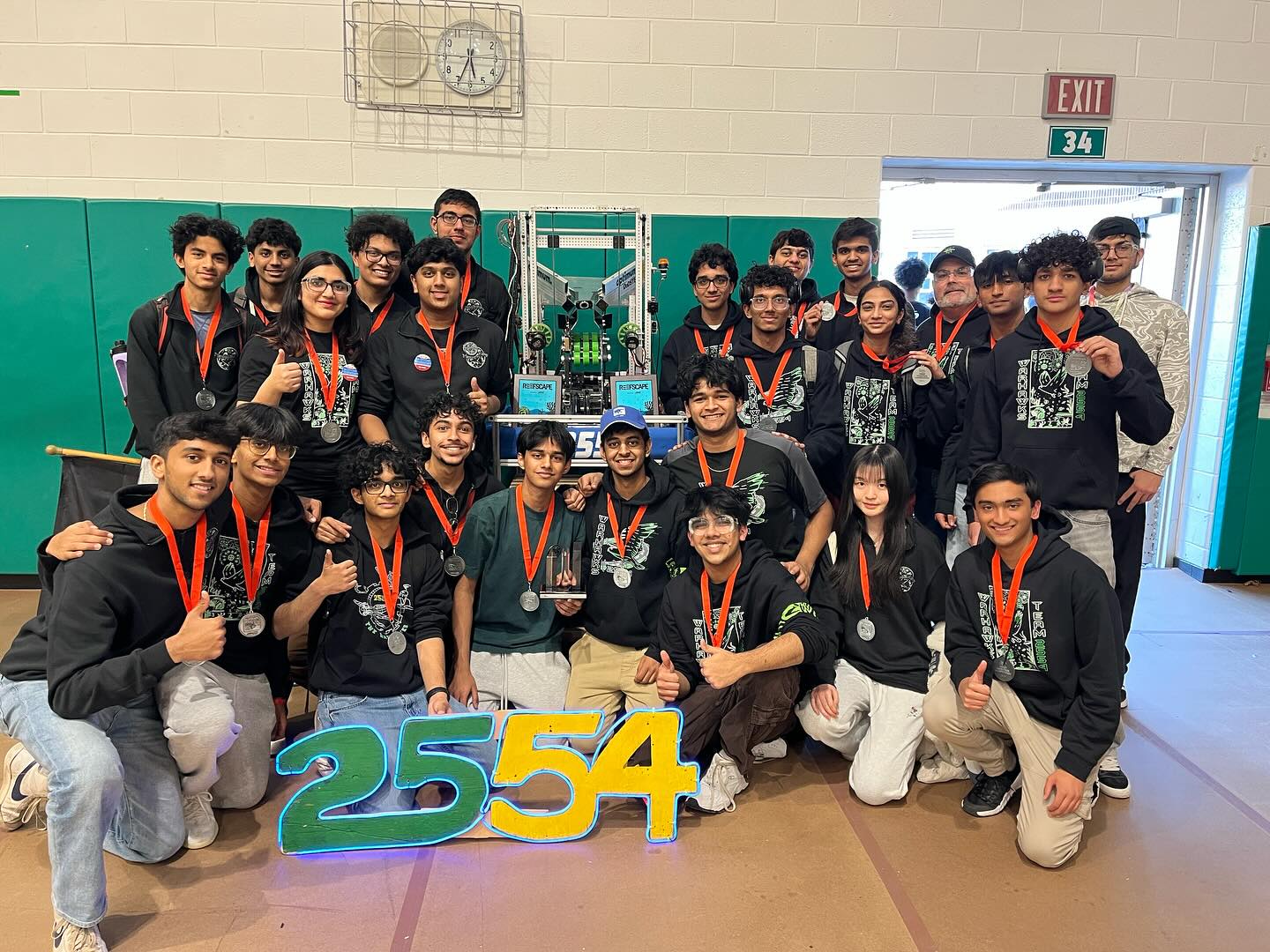 Students from FIRST Robotics Team 2554, the Warhawks